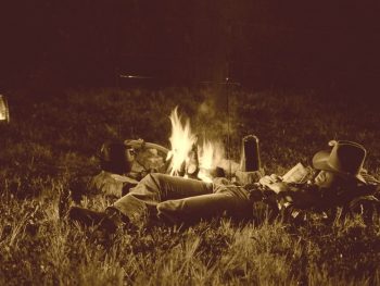 cowboy asleep by the campfire