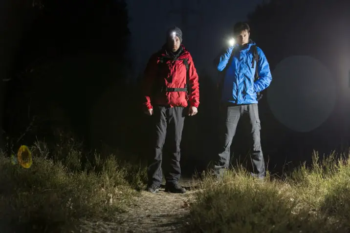 hikers with a flashlight