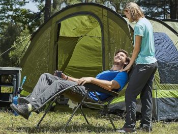 man sitting in a camping chair