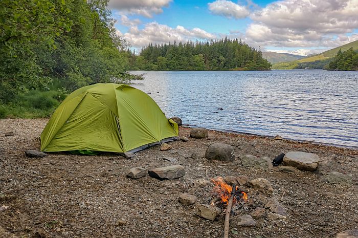 a tent near the edge of a lake