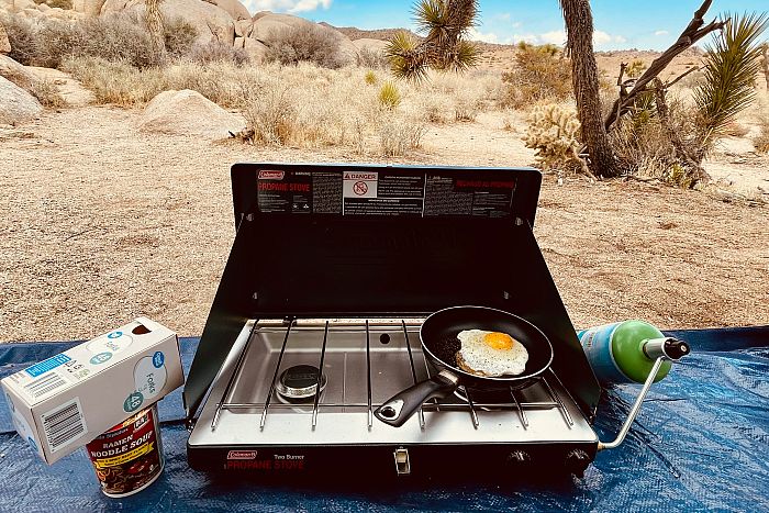 camp stove with a desert background