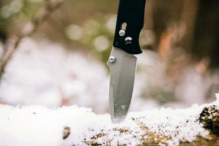 pocketknife stuck in a log